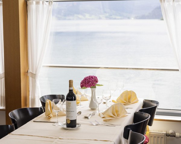 Two guests enjoy lunch on deck.